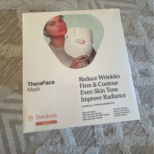 Theraface by Therabody mask, in unopened box with plastic wrapping.